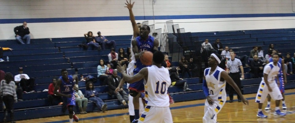 Cordaryl Campbell driving to the basket over Fisk defenders.
